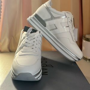 New with tags Hogan sneakers never worn. Excellent condition.
